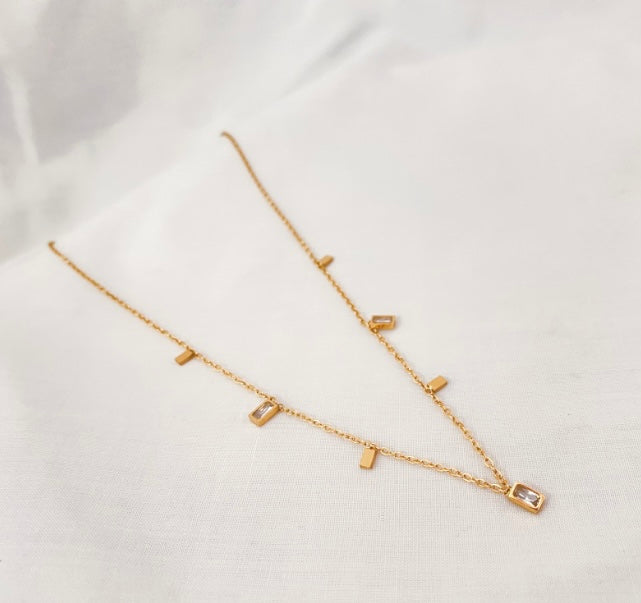 golden stainless steel necklace with small cubic zirconia pendants