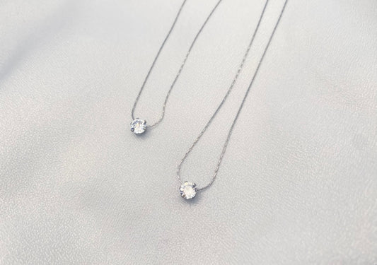 stainless steel necklace with delicate cubic zirconia pendant